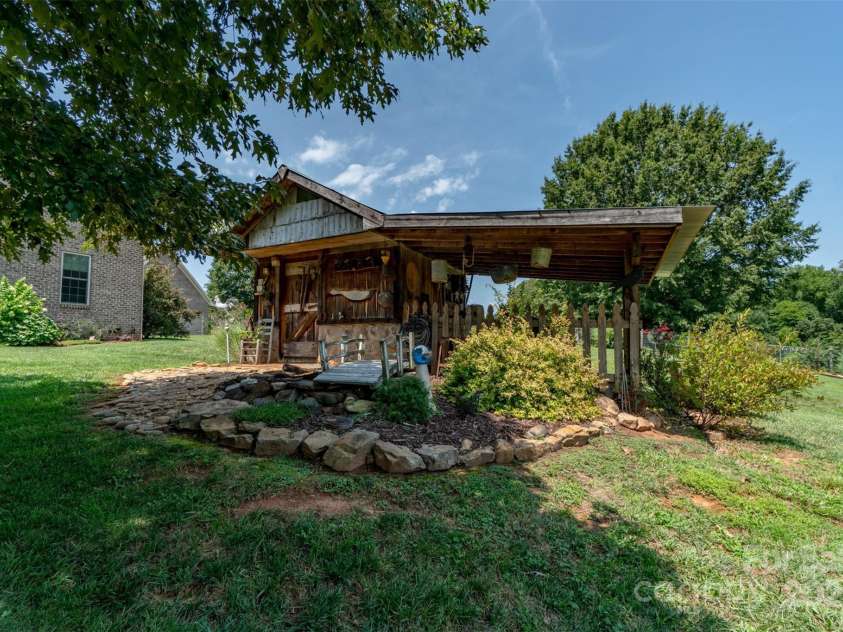 1519 Triplett Road, Cleveland, NC 27013.  MLS# CAR4218302, YatesRealty ID 7715. Charming Well House/She Shed With Lean To and Bridge Over The Pond