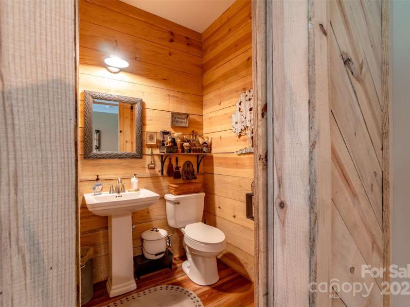 1519 Triplett Road, Cleveland, NC 27013.  MLS# CAR4218302, YatesRealty ID 7715. Rough Sawn Pine Boards Cover The Walls Of The 1/2 Bathroom Located In The Office/Flex Room.