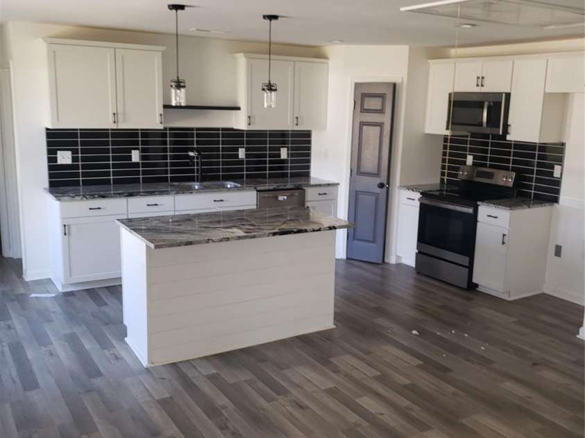 611 Fernwood Drive, Albemarle, NC 28001.  MLS# CAR4344748, YatesRealty ID 7722. Kitchen and great room