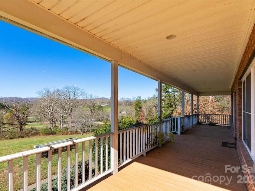 1025 Upper Brush Creek Road, Fairview, NC 28730.  MLS# CAR4195772, YatesRealty ID 7723. Covered front porch.