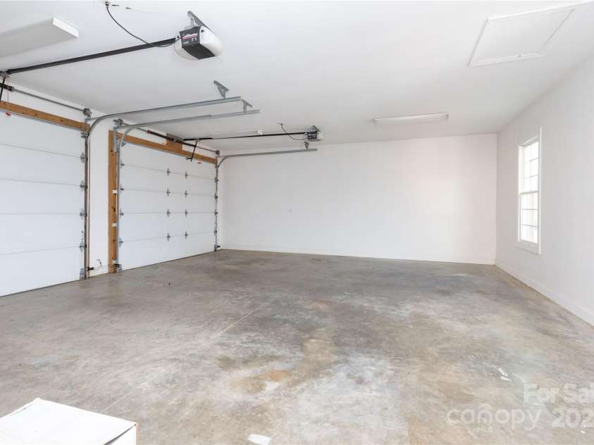 1025 Upper Brush Creek Road, Fairview, NC 28730.  MLS# CAR4195772, YatesRealty ID 7723. Detached two car garage with attic storage.