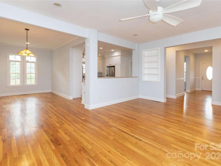 1025 Upper Brush Creek Road, Fairview, NC 28730.  MLS# CAR4195772, YatesRealty ID 7723. Living space open to kitchen in dining room.