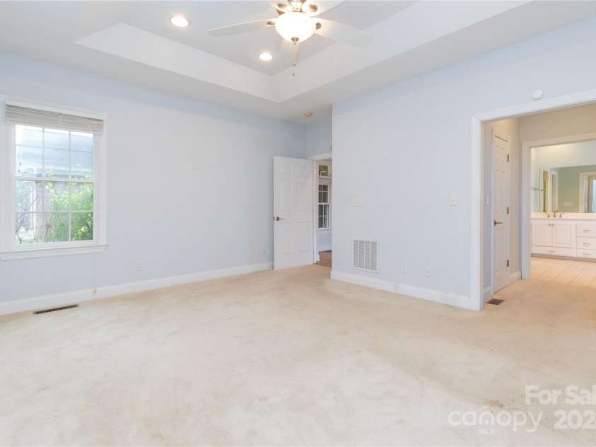 1025 Upper Brush Creek Road, Fairview, NC 28730.  MLS# CAR4195772, YatesRealty ID 7723. Massive primary bedroom with sitting area.