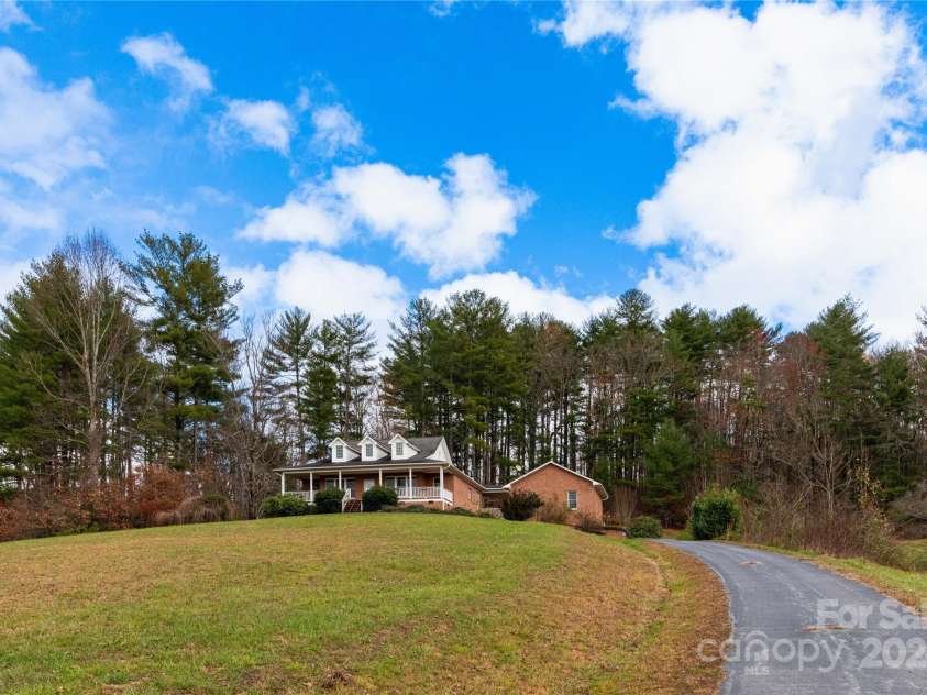 1025 Upper Brush Creek Road, Fairview, NC 28730.  MLS# CAR4195772, YatesRealty ID 7723. View from front yard.