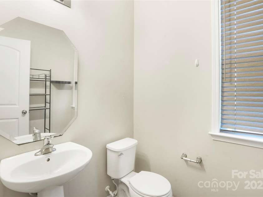 7535 Meridale Forest Drive, Charlotte, NC 28269.  MLS# CAR4221916, YatesRealty ID 7726. Half bathroom