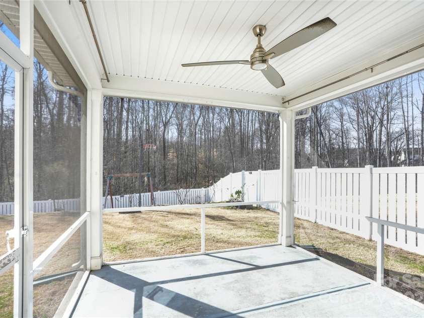 7535 Meridale Forest Drive, Charlotte, NC 28269.  MLS# CAR4221916, YatesRealty ID 7726. Screened lanai off of kitchen