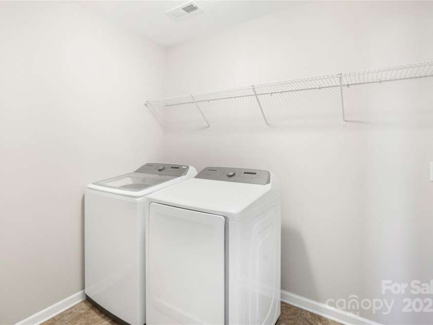 7535 Meridale Forest Drive, Charlotte, NC 28269.  MLS# CAR4221916, YatesRealty ID 7726. Upper level laundry room