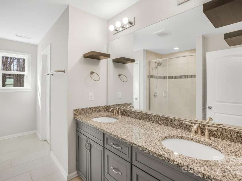 7535 Meridale Forest Drive, Charlotte, NC 28269.  MLS# CAR4221916, YatesRealty ID 7726. Upper level Primary bathroom
