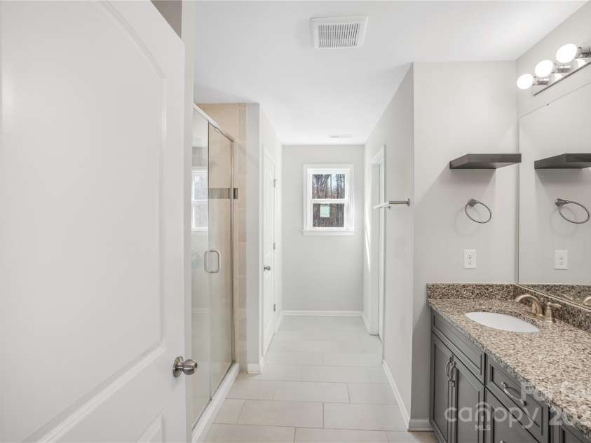 7535 Meridale Forest Drive, Charlotte, NC 28269.  MLS# CAR4221916, YatesRealty ID 7726. Upper level Primary bathroom