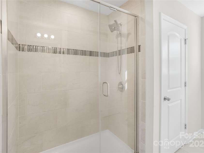 7535 Meridale Forest Drive, Charlotte, NC 28269.  MLS# CAR4221916, YatesRealty ID 7726. Upper level Primary bathroom shower