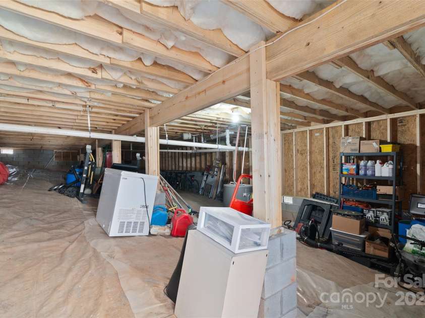 16 Spring Street, Candler, NC 28715.  MLS# CAR4231602, YatesRealty ID 7737. Crawlspace storage