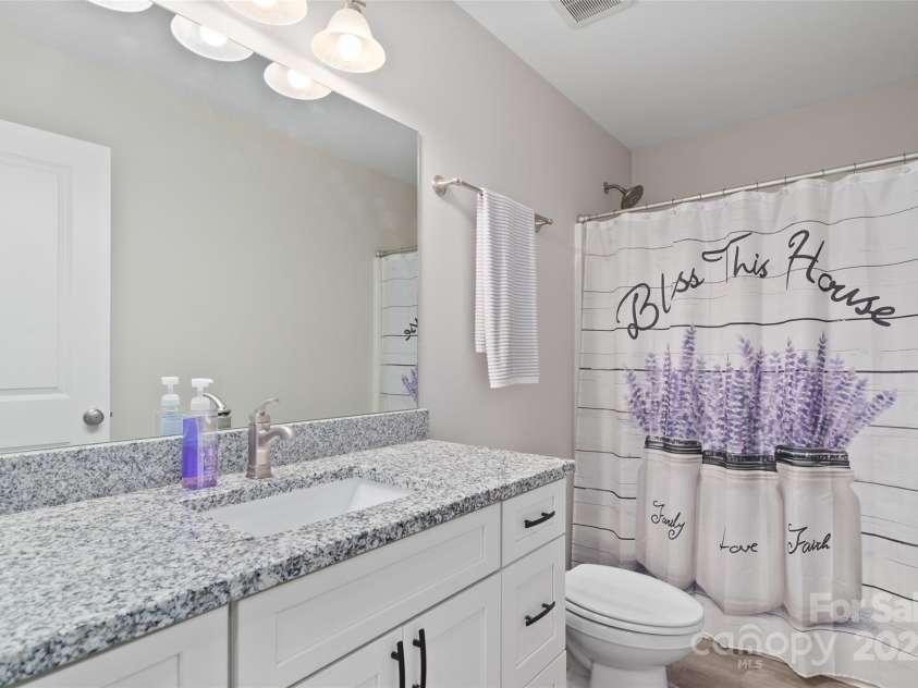 16 Spring Street, Candler, NC 28715.  MLS# CAR4231602, YatesRealty ID 7737. Guest bathroom