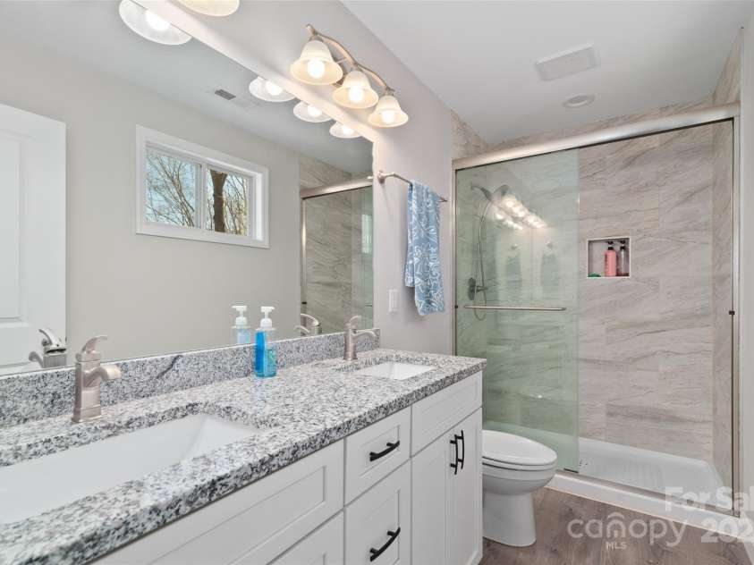 16 Spring Street, Candler, NC 28715.  MLS# CAR4231602, YatesRealty ID 7737. Primary Bathroom