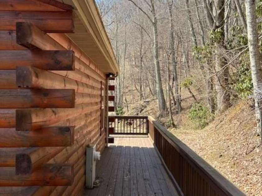 399 Bent Tree Road, Maggie Valley, NC 28751.  MLS# CAR4359236, YatesRealty ID 7738. Back deck; decking wraps completely around the home