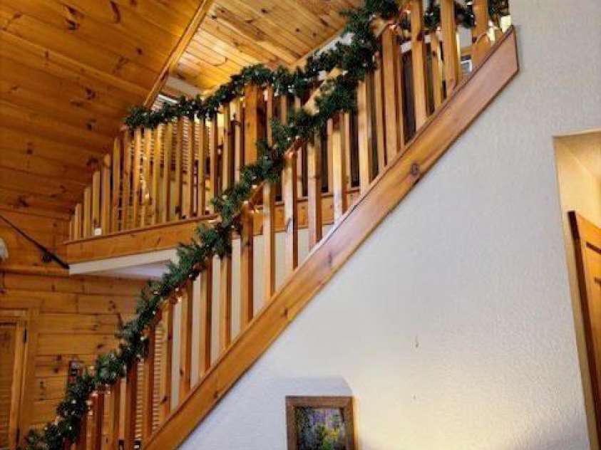 399 Bent Tree Road, Maggie Valley, NC 28751.  MLS# CAR4359236, YatesRealty ID 7738. Living room; open to loft