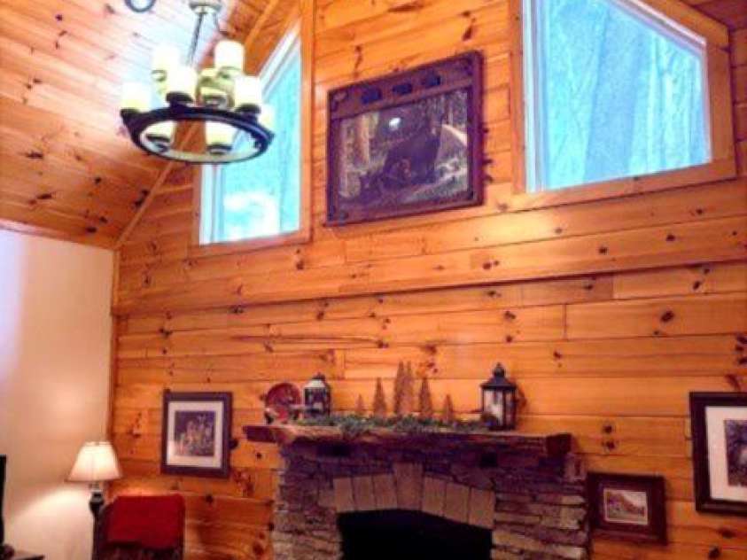 399 Bent Tree Road, Maggie Valley, NC 28751.  MLS# CAR4359236, YatesRealty ID 7738. Living room; with fireplace & cathedral ceiling