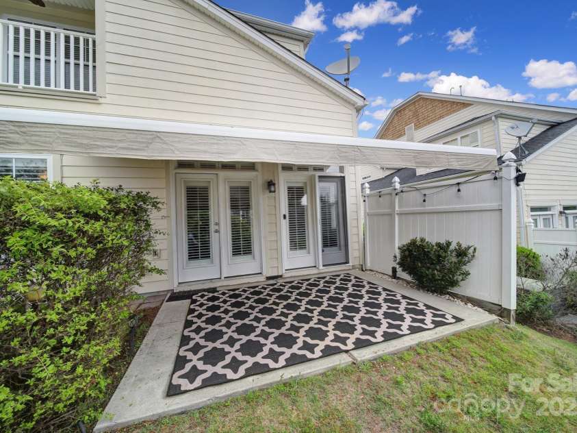 314 Wave Crest Drive, Tega Cay, SC 29708.  MLS# CAR4245002, YatesRealty ID 7739. Back Patio w/ Awning Extended