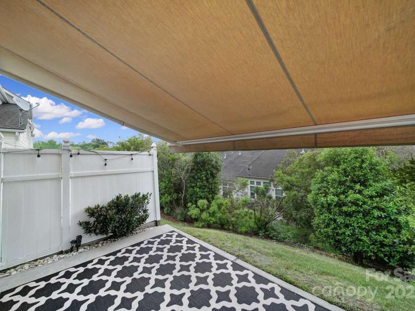 314 Wave Crest Drive, Tega Cay, SC 29708.  MLS# CAR4245002, YatesRealty ID 7739. Back Patio w/ Awning Extended