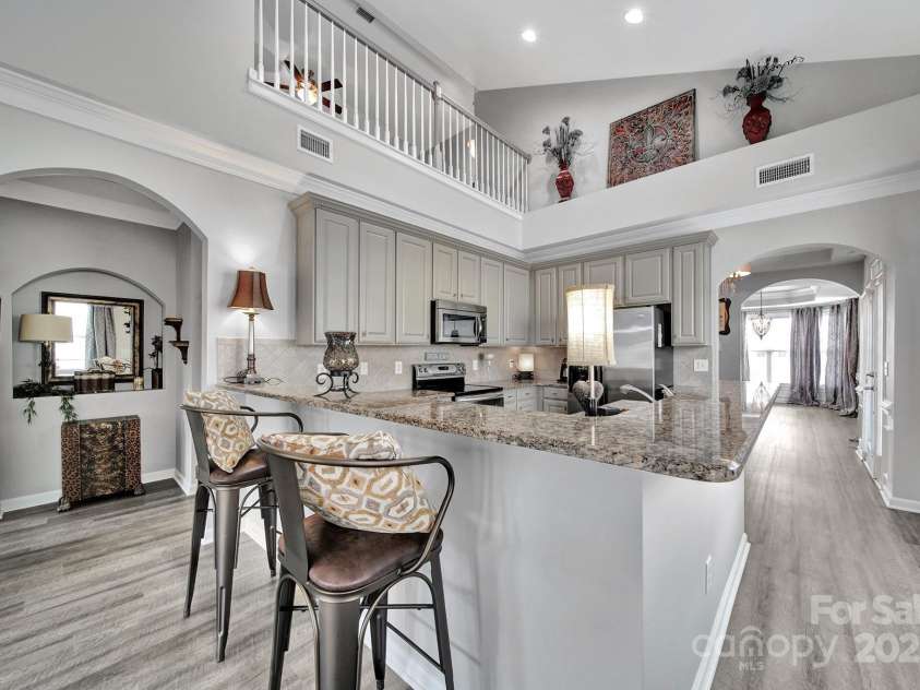 314 Wave Crest Drive, Tega Cay, SC 29708.  MLS# CAR4245002, YatesRealty ID 7739. Kitchen and Loft from Great Room