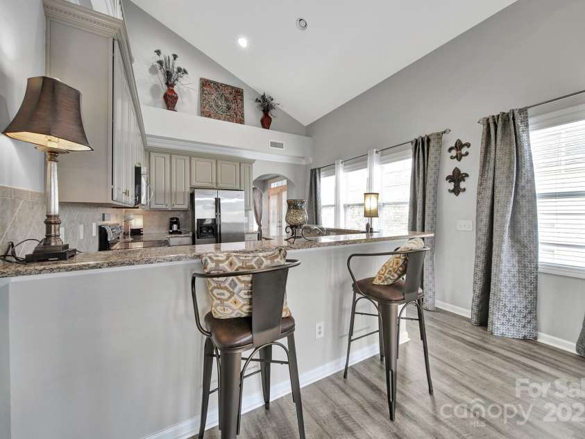 314 Wave Crest Drive, Tega Cay, SC 29708.  MLS# CAR4245002, YatesRealty ID 7739. Kitchen bar from Great Room