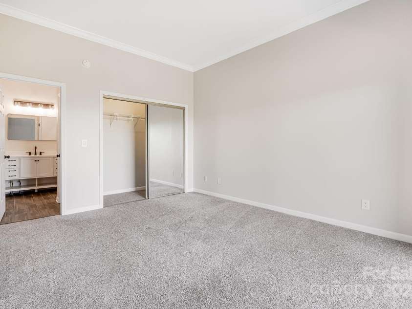 546 Windswept Drive, Asheville, NC 28801.  MLS# CAR4248242, YatesRealty ID 7747. Bright Primary Suite Features a Large Closet and Ensuite Full Bath