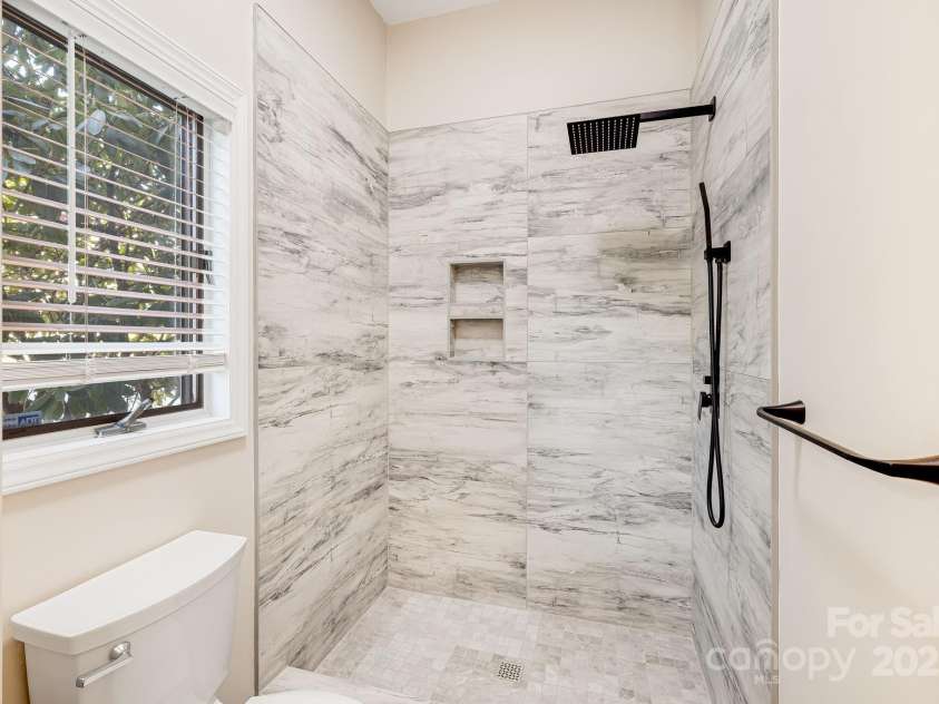 546 Windswept Drive, Asheville, NC 28801.  MLS# CAR4248242, YatesRealty ID 7747. Custom Tiled, Walk-In Shower