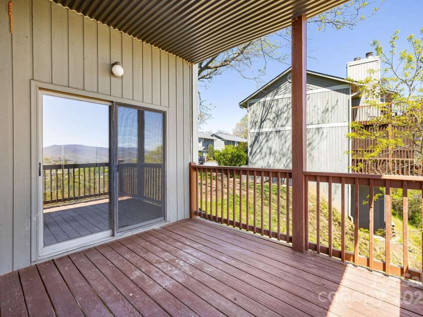 546 Windswept Drive, Asheville, NC 28801.  MLS# CAR4248242, YatesRealty ID 7747. Portion of Back Deck Off of Primary Suite