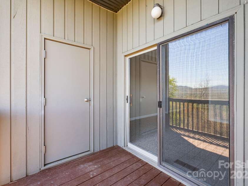 546 Windswept Drive, Asheville, NC 28801.  MLS# CAR4248242, YatesRealty ID 7747. Storage Closet for Tools + Toys On Back Deck