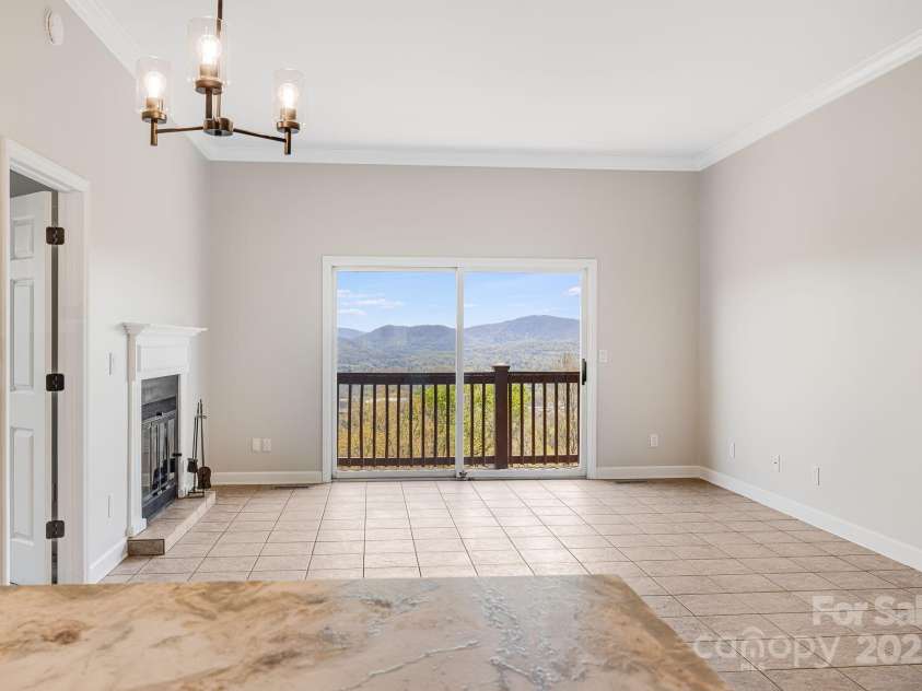 546 Windswept Drive, Asheville, NC 28801.  MLS# CAR4248242, YatesRealty ID 7747. Wrap-Around Counter with Breakfast Bar Connects Kitchen with Living Area