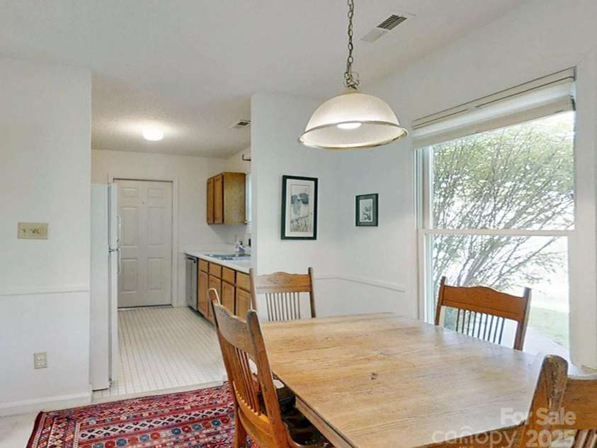 204 Rocky Mountain Way, Arden, NC 28704.  MLS# CAR4248620, YatesRealty ID 7748. Dining area adjoining kitchen