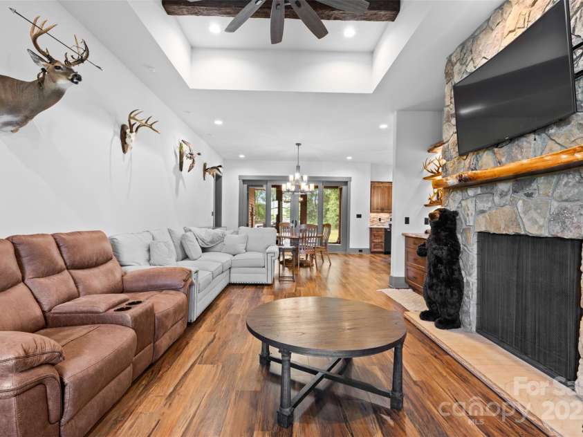 1822 Irby Road, Monroe, NC 28112.  MLS# CAR4259856, YatesRealty ID 776. Guest Home Living Room with Stone Fireplace 