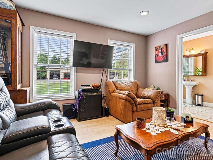 6051 Pointe West Lane, Vale, NC 28168.  MLS# CAR4357030, YatesRealty ID 7760. Downstairs bedroom - Primary Suite - with ensuite half bath