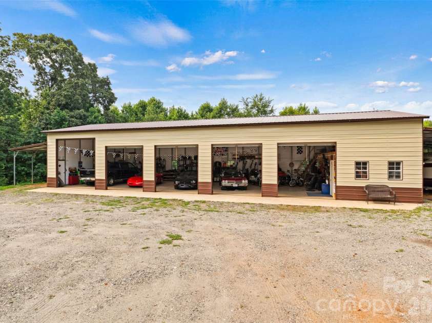 6051 Pointe West Lane, Vale, NC 28168.  MLS# CAR4357030, YatesRealty ID 7760. Large 5 bay garage with home office 