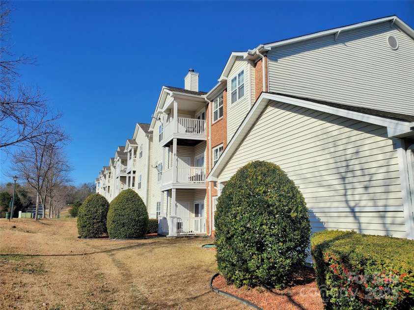 10526 Hill Point Court, Charlotte, NC 28262.  MLS# CAR4246661, YatesRealty ID 7763. Side View of Building