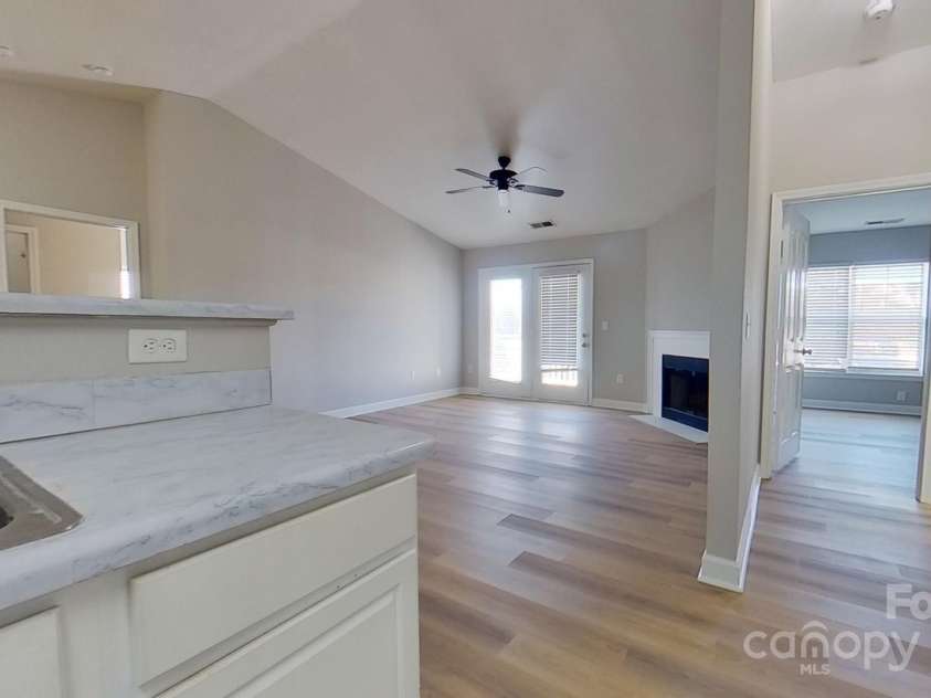 10526 Hill Point Court, Charlotte, NC 28262.  MLS# CAR4246661, YatesRealty ID 7763. View of Living Room and front bedroom from kitchen