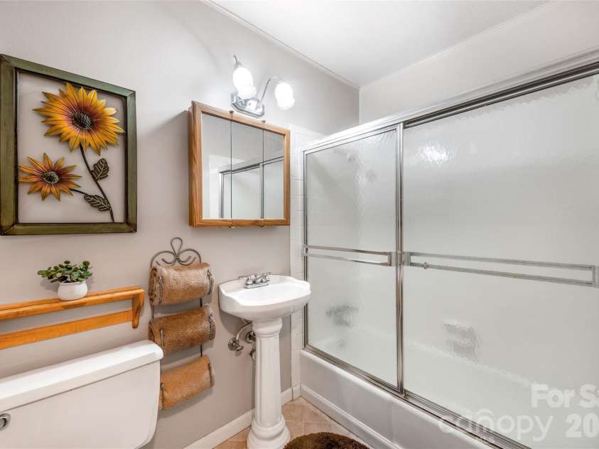 102 Boyd Drive, Flat Rock, NC 28731.  MLS# CAR4424177, YatesRealty ID 7764. Guest Bathroom