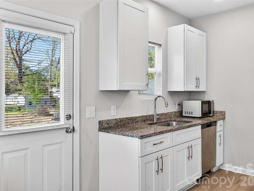 1312 7th Street, Statesville, NC 28677.  MLS# CAR4360149, YatesRealty ID 7776. Kitchen with side entry door