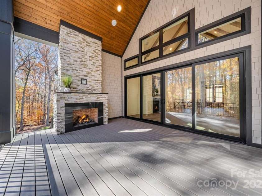 155 Copper Pine Lane, Davidson, NC 28036.  MLS# CAR4055268, YatesRealty ID 778. Balcony Porch with Outdoor Fireplace