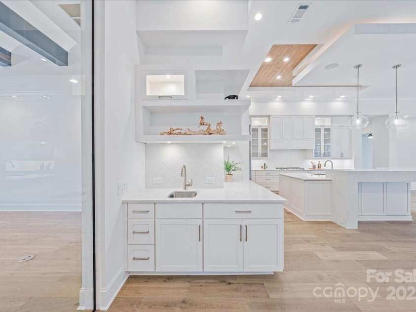 155 Copper Pine Lane, Davidson, NC 28036.  MLS# CAR4055268, YatesRealty ID 778. Great Room Wet Bar and Kitchen