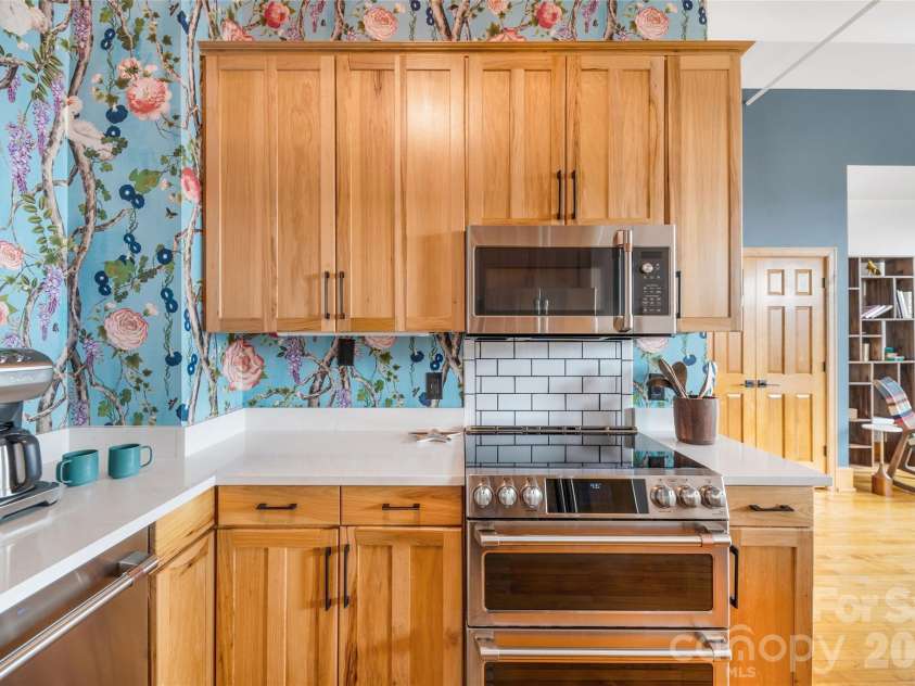 59 College Street, Asheville, NC 28801.  MLS# CAR4415642, YatesRealty ID 7780. Solid hardwood cabinets in the kitchen.