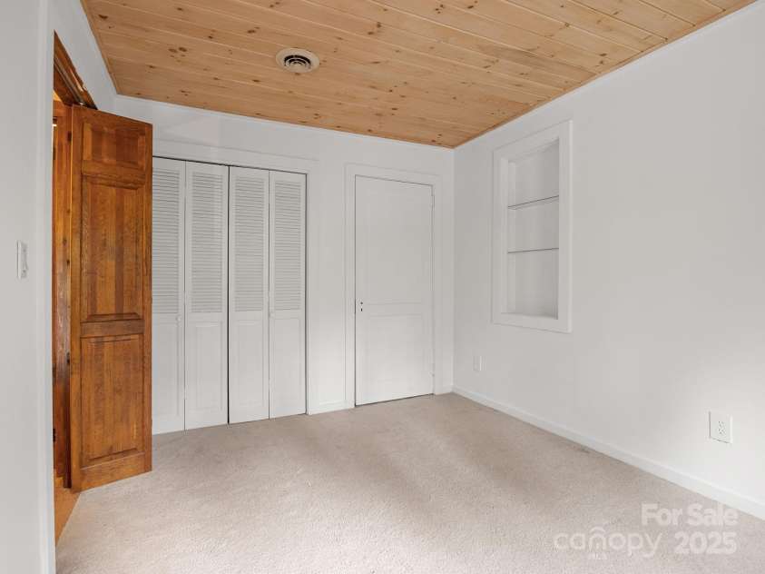 241 Pinefield Drive, Tryon, NC 28782.  MLS# CAR4250675, YatesRealty ID 7781. Guest Bedroom has two closets