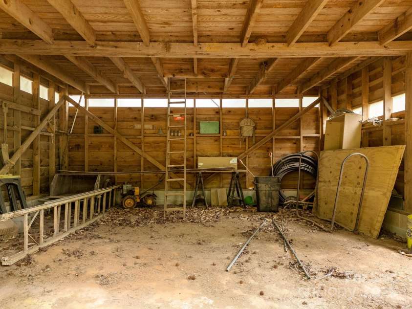241 Pinefield Drive, Tryon, NC 28782.  MLS# CAR4250675, YatesRealty ID 7781. Interior of the barn