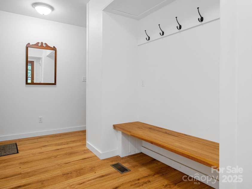 241 Pinefield Drive, Tryon, NC 28782.  MLS# CAR4250675, YatesRealty ID 7781. Mudroom/Laundry Room with space to remove shoes and hang coats.