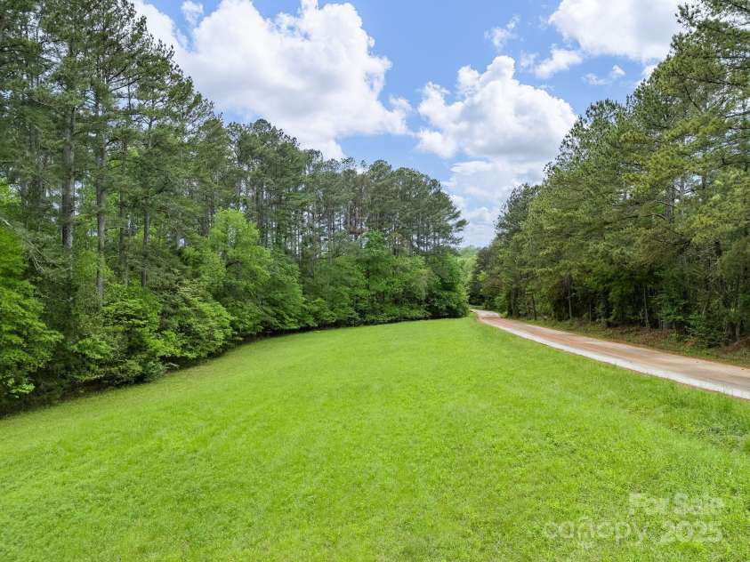 241 Pinefield Drive, Tryon, NC 28782.  MLS# CAR4250675, YatesRealty ID 7781. One of the fields