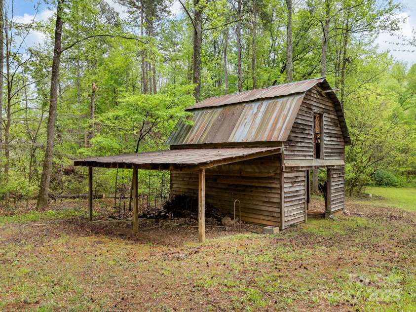 241 Pinefield Drive, Tryon, NC 28782.  MLS# CAR4250675, YatesRealty ID 7781. Rustic barn