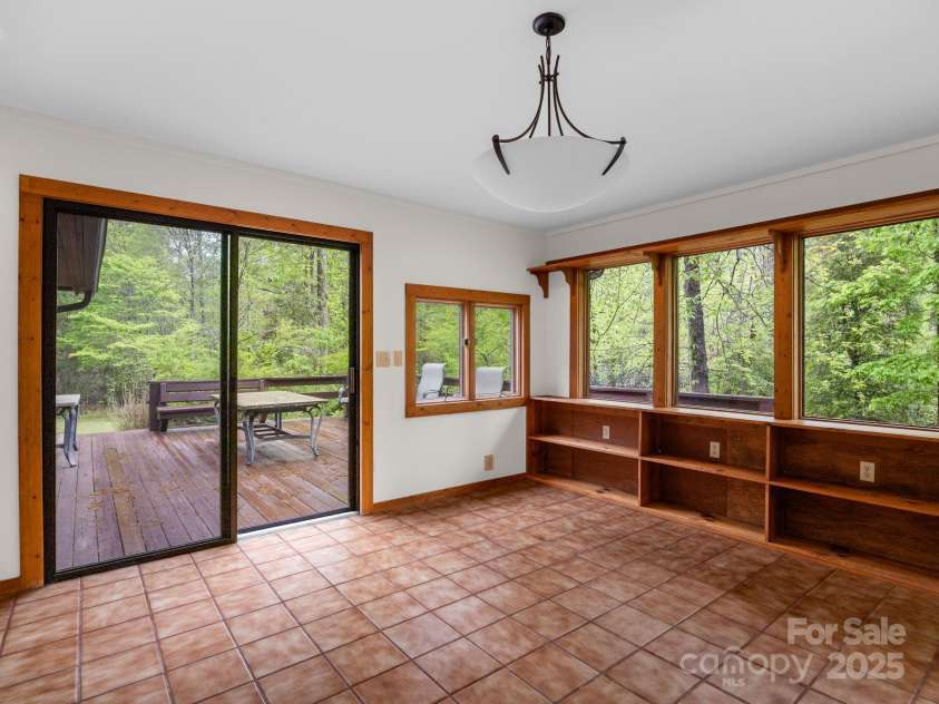 241 Pinefield Drive, Tryon, NC 28782.  MLS# CAR4250675, YatesRealty ID 7781. Sunroom is heated and cooled.