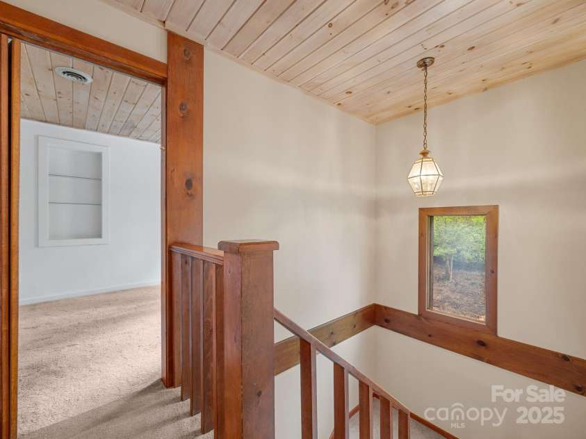 241 Pinefield Drive, Tryon, NC 28782.  MLS# CAR4250675, YatesRealty ID 7781. Upstairs. Doorway leads to guest bedroom