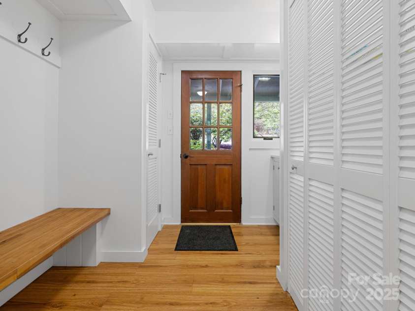 241 Pinefield Drive, Tryon, NC 28782.  MLS# CAR4250675, YatesRealty ID 7781. Washing machine and dryer tucked behind the closet doors