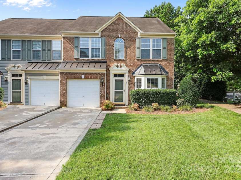 157 Talbert Town Loop, Mooresville, NC 28117.  MLS# CAR4275310, YatesRealty ID 7789. Outside, enjoy the convenience of a one-car attached garage plus extra driveway parking.