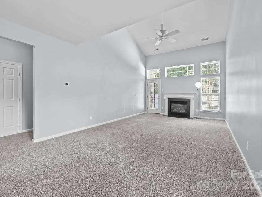 157 Talbert Town Loop, Mooresville, NC 28117.  MLS# CAR4275310, YatesRealty ID 7789. The living area is highlighted by soaring ceilings and an abundance of natural light